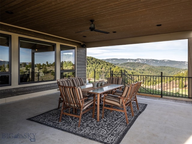 449 Minni Hall Rd, Bozeman, MT 59715 - view of patio / terrace featuring a mountain view, outdoor dining area, and a ceiling fan