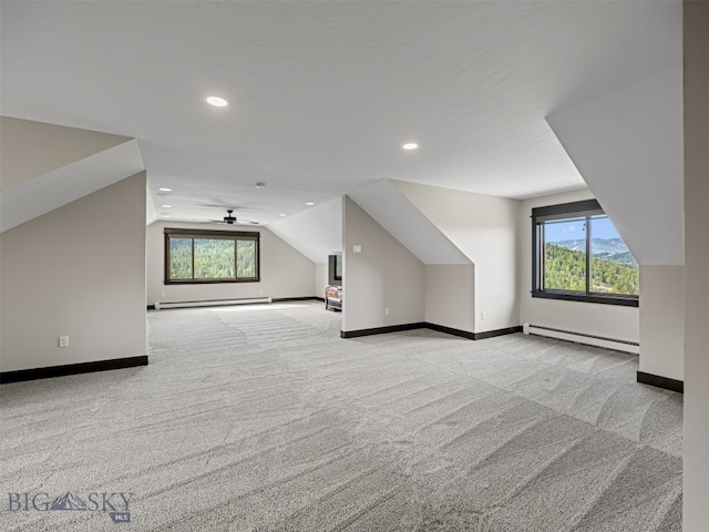 449 Minni Hall Rd, Bozeman, MT 59715 - additional living space with a baseboard heating unit, carpet floors, lofted ceiling, baseboards, and recessed lighting