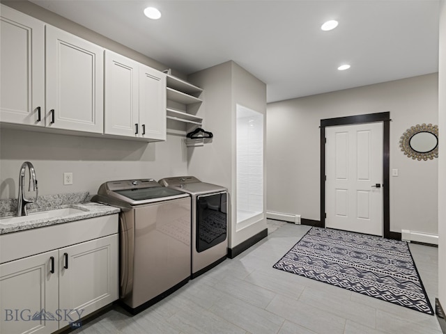 449 Minni Hall Rd, Bozeman, MT 59715 - laundry room featuring separate washer and dryer, a baseboard heating unit, recessed lighting, baseboard heating, and cabinet space