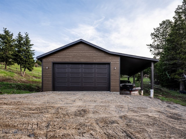 449 Minni Hall Rd, Bozeman, MT 59715 - garage featuring a garage and driveway