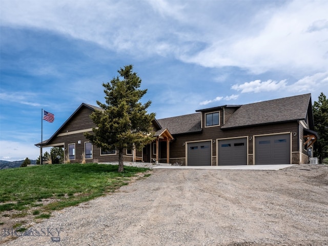 449 Minni Hall Rd, Bozeman, MT 59715 - view of front facade with driveway, an attached garage, a front yard, and a shingled roof