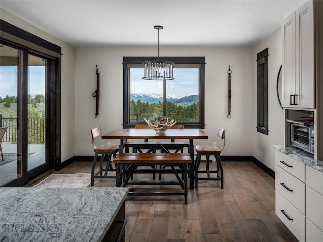 449 Minni Hall Rd, Bozeman, MT 59715 - dining room with a chandelier, healthy amount of natural light, and dark wood-style floors
