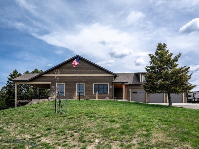 449 Minni Hall Rd, Bozeman, MT 59715 - view of front of house featuring a front lawn, roof with shingles, driveway, and an attached garage
