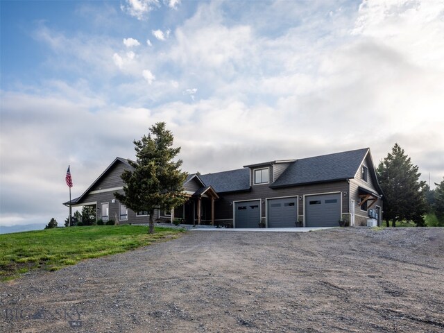 449 Minni Hall Rd, Bozeman, MT 59715 - view of front of home with driveway, an attached garage, and roof with shingles
