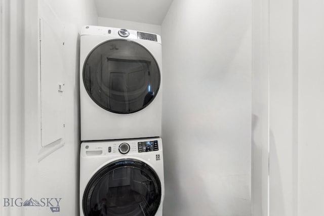 laundry room with stacked washer and clothes dryer