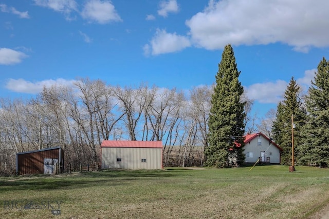 185 Elk Creek Rd N, Wilsall, MT 59086 - view of green lawn with an outbuilding and an outdoor structure