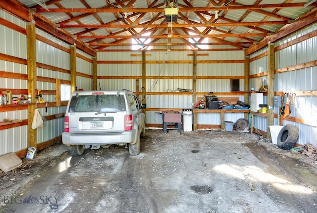 185 Elk Creek Rd N, Wilsall, MT 59086 - garage featuring metal wall and a garage door opener