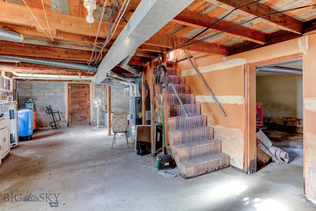 185 Elk Creek Rd N, Wilsall, MT 59086 - unfinished basement featuring stairs and a water pressure tank
