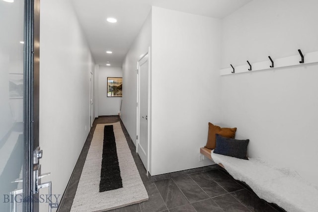 mudroom featuring recessed lighting and dark tile patterned flooring
