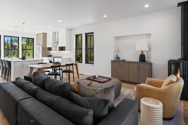 living room with recessed lighting and light wood-style floors