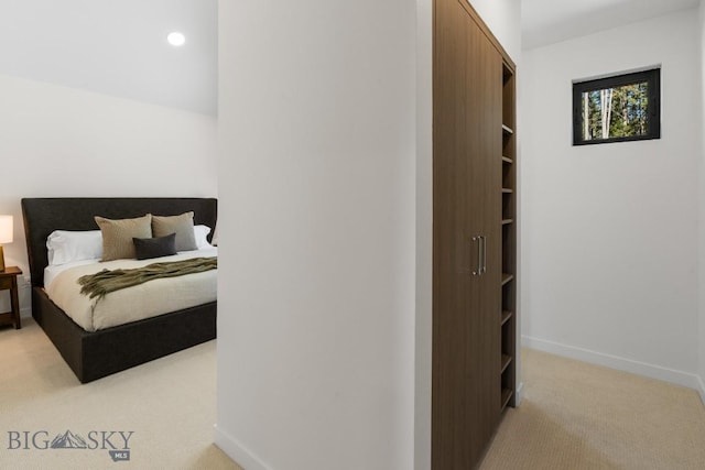 bedroom featuring light carpet, baseboards, and recessed lighting