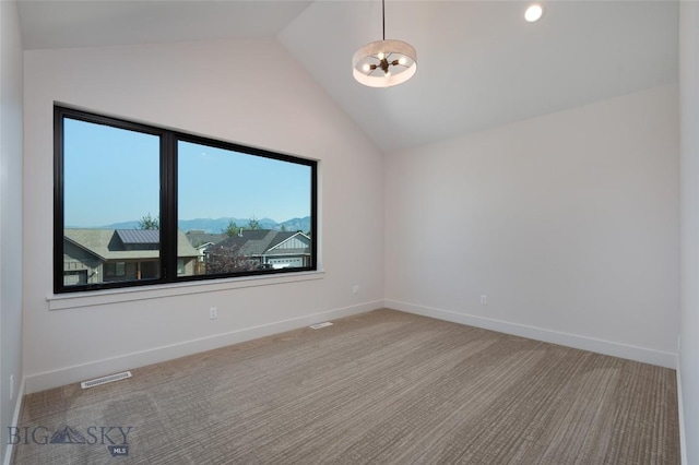 3030 Autumn Grove St Unit C, Bozeman, MT 59718 - unfurnished room featuring lofted ceiling, a chandelier, carpet flooring, and baseboards