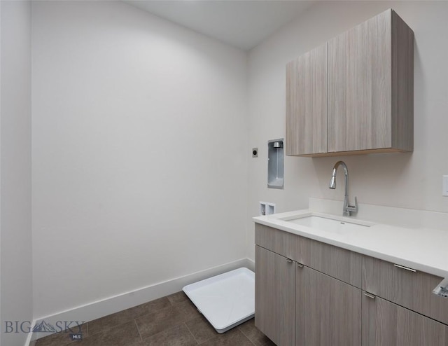 3030 Autumn Grove St Unit C, Bozeman, MT 59718 - clothes washing area with washer hookup, cabinet space, baseboards, and hookup for an electric dryer
