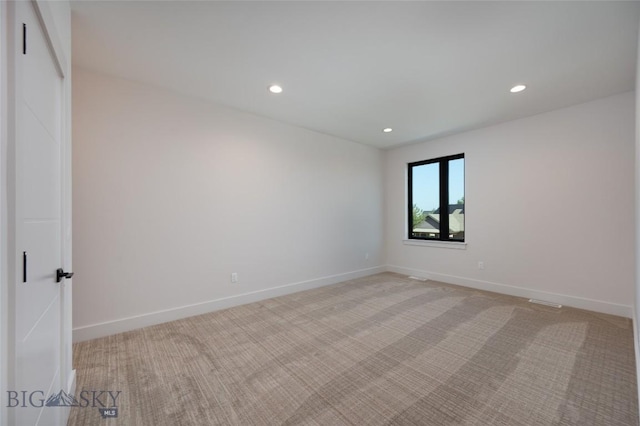 3030 Autumn Grove St Unit C, Bozeman, MT 59718 - unfurnished room with light colored carpet, recessed lighting, and baseboards