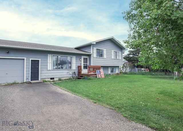 902 E Gallatin Ave, Belgrade, MT 59714 - tri-level home featuring an attached garage, a front yard, and asphalt driveway