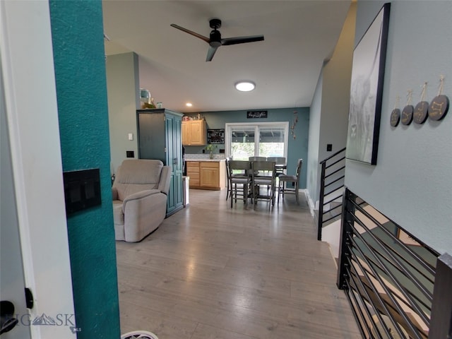 902 E Gallatin Ave, Belgrade, MT 59714 - living area with a ceiling fan, light wood-style floors, and a fireplace