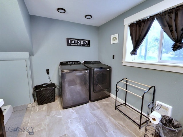 902 E Gallatin Ave, Belgrade, MT 59714 - clothes washing area featuring washing machine and dryer and baseboards
