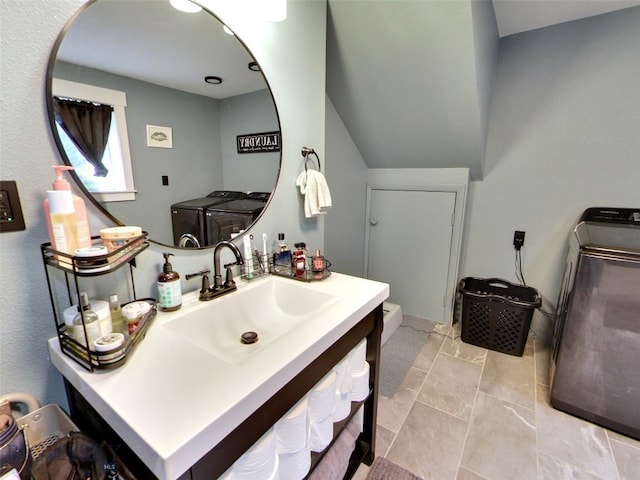 902 E Gallatin Ave, Belgrade, MT 59714 - bathroom featuring washing machine and dryer, vanity, and toilet