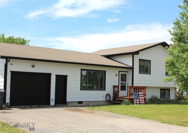902 E Gallatin Ave, Belgrade, MT 59714 - tri-level home with driveway, a garage, and a front lawn