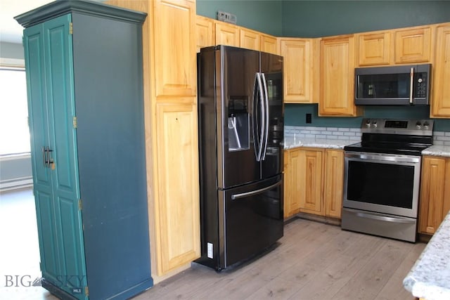 902 E Gallatin Ave, Belgrade, MT 59714 - kitchen featuring fridge with ice dispenser, stainless steel electric stove, light wood-type flooring, light brown cabinetry, and light stone counters