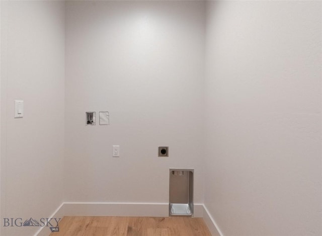 laundry room with hookup for a washing machine, light wood finished floors, baseboards, and hookup for an electric dryer