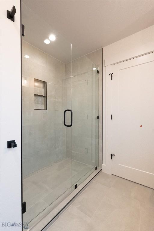 full bathroom featuring a shower stall, recessed lighting, and tile patterned flooring
