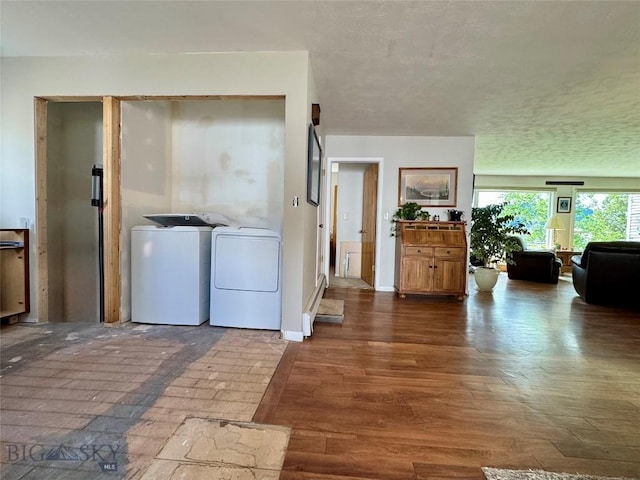 205 E Chinook St, Livingston, MT 59047 - laundry room with independent washer and dryer, dark wood-style flooring, and baseboards