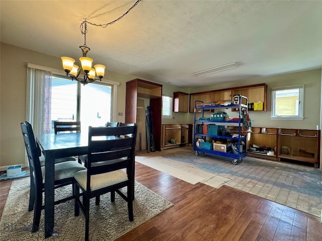 205 E Chinook St, Livingston, MT 59047 - dining space featuring a chandelier and wood finished floors