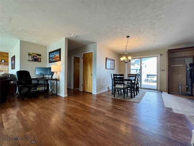 205 E Chinook St, Livingston, MT 59047 - dining area with a textured ceiling, hardwood / wood-style floors, a chandelier, an office area, and baseboards