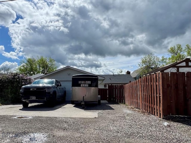 205 E Chinook St, Livingston, MT 59047 - view of property exterior with fence and concrete driveway