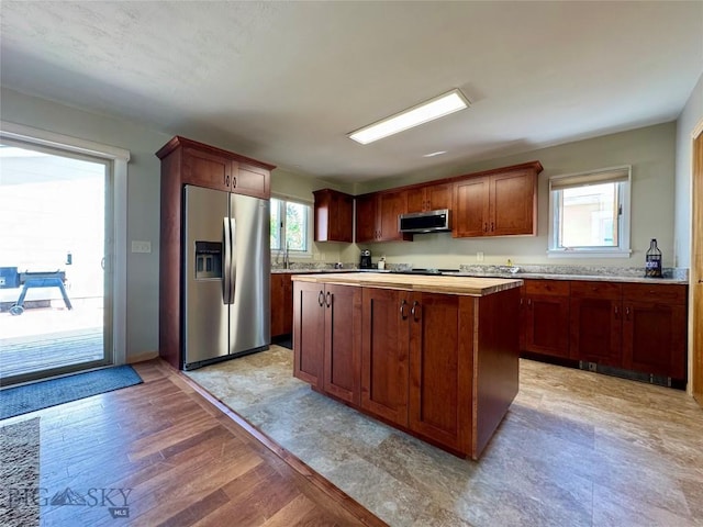 205 E Chinook St, Livingston, MT 59047 - kitchen featuring appliances with stainless steel finishes, light countertops, plenty of natural light, and light wood-style flooring
