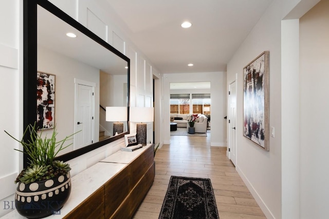 1210 Cody Dr, Belgrade, MT 59714 - hallway with light wood finished floors, stairway, and recessed lighting