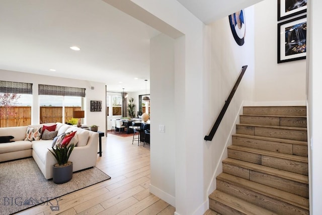 1210 Cody Dr, Belgrade, MT 59714 - staircase with wood-type flooring, recessed lighting, and baseboards