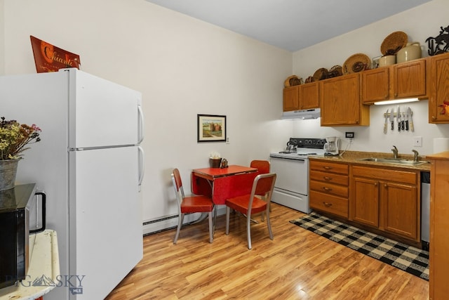 530 W Hulbert Rd, Bozeman, MT 59718 - kitchen with white appliances, under cabinet range hood, a sink, a baseboard heating unit, and light wood-style flooring