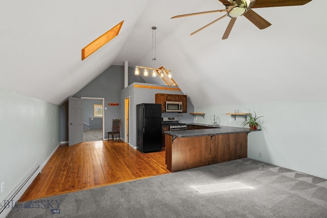 530 W Hulbert Rd, Bozeman, MT 59718 - kitchen featuring baseboard heating, stainless steel appliances, a peninsula, dark countertops, and ceiling fan