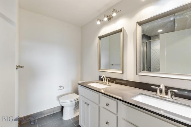 bathroom featuring tile patterned flooring, toilet, an enclosed shower, and double vanity
