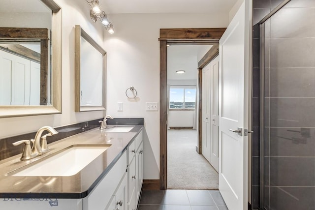 bathroom featuring tile patterned floors and double vanity