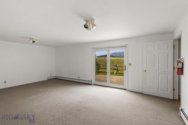 601 N C St, Livingston, MT 59047 - empty room with baseboard heating and light colored carpet