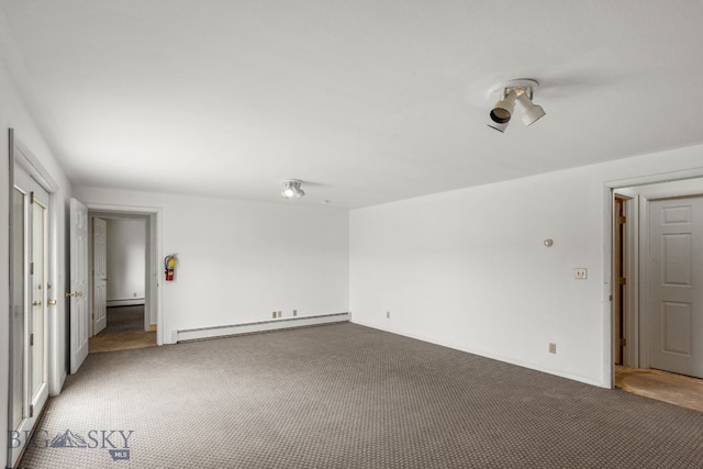 601 N C St, Livingston, MT 59047 - unfurnished bedroom featuring baseboard heating, carpet flooring, and baseboards