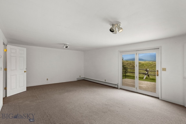 601 N C St, Livingston, MT 59047 - carpeted spare room featuring a baseboard heating unit