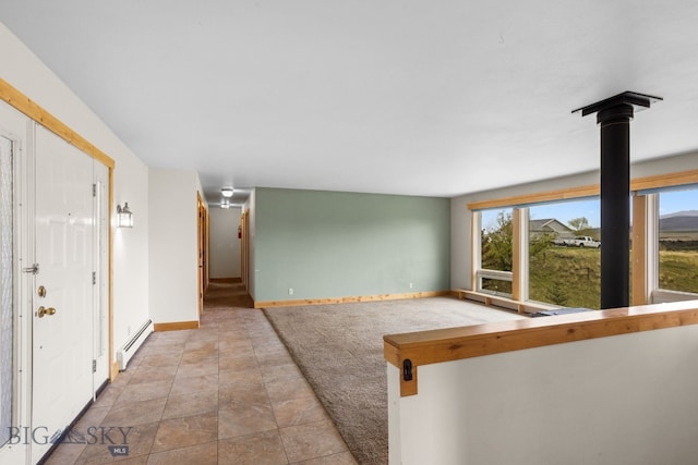 601 N C St, Livingston, MT 59047 - entryway featuring a baseboard radiator and baseboards