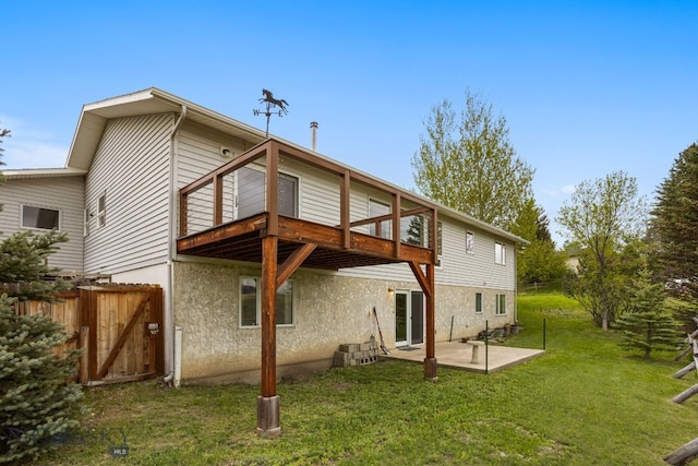 601 N C St, Livingston, MT 59047 - back of property with a patio, stucco siding, and a wooden deck