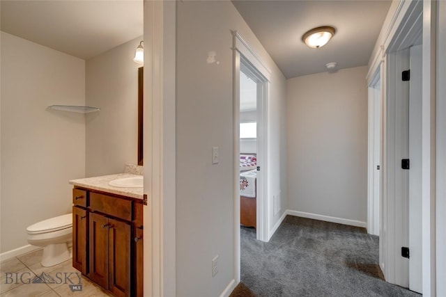 1510 Ingomar Blvd, Belgrade, MT 59714 - hallway with baseboards, light colored carpet, and a sink