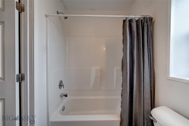 1510 Ingomar Blvd, Belgrade, MT 59714 - bathroom with toilet and shower / bathtub combination with curtain