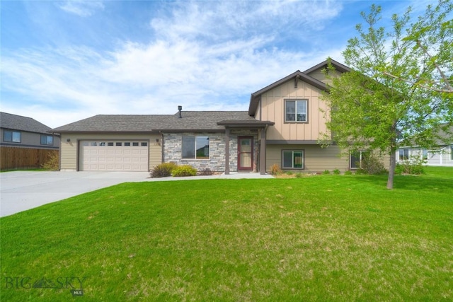 1510 Ingomar Blvd, Belgrade, MT 59714 - tri-level home with board and batten siding, a garage, driveway, and stone siding