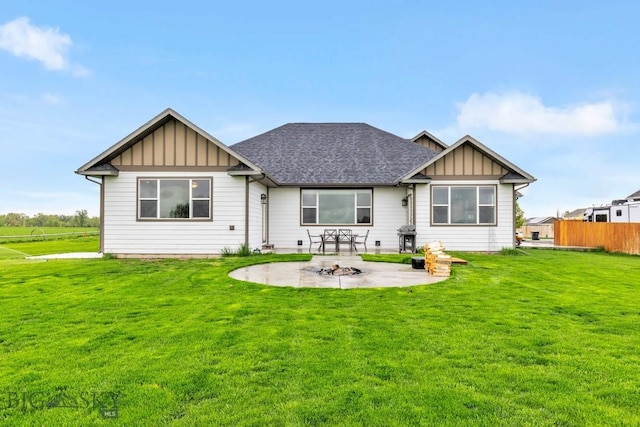 680 Countryside Ln, Belgrade, MT 59714 - back of property with board and batten siding, a patio, a fire pit, and roof with shingles