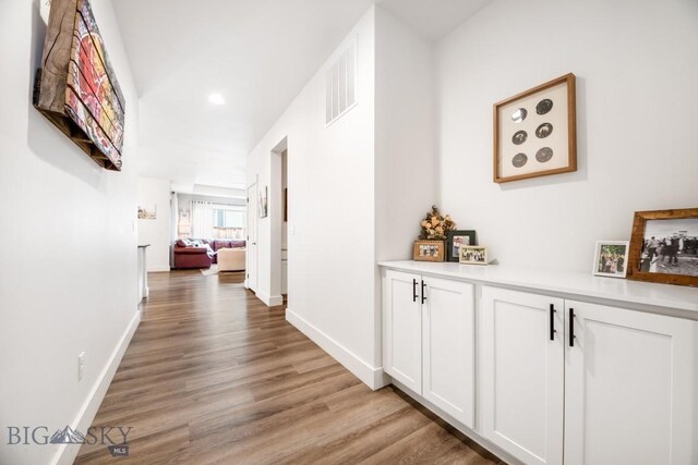 1506 Wild Bill Way, Belgrade, MT 59714 - hall featuring light wood-style flooring, baseboards, and recessed lighting