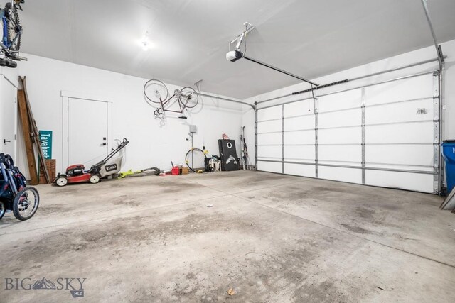 1506 Wild Bill Way, Belgrade, MT 59714 - garage featuring a garage door opener