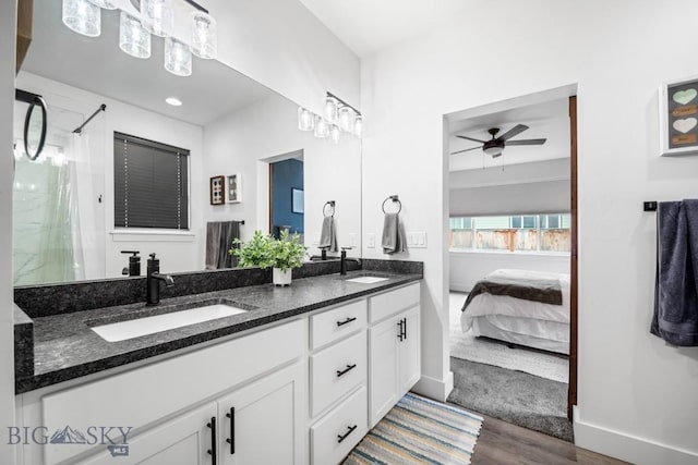 1506 Wild Bill Way, Belgrade, MT 59714 - ensuite bathroom with a ceiling fan, double vanity, wood finished floors, a shower, and baseboards