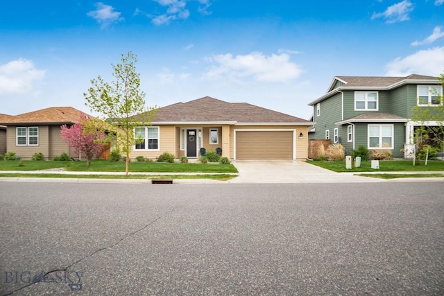 1506 Wild Bill Way, Belgrade, MT 59714 - view of front of home featuring an attached garage, driveway, and a front lawn